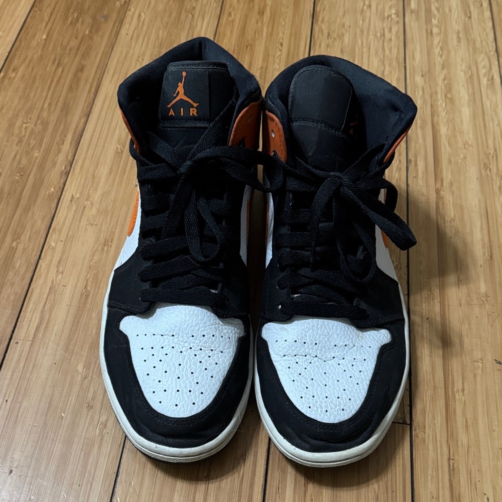 Nike Black, White, and Orange High-Top Sneakers